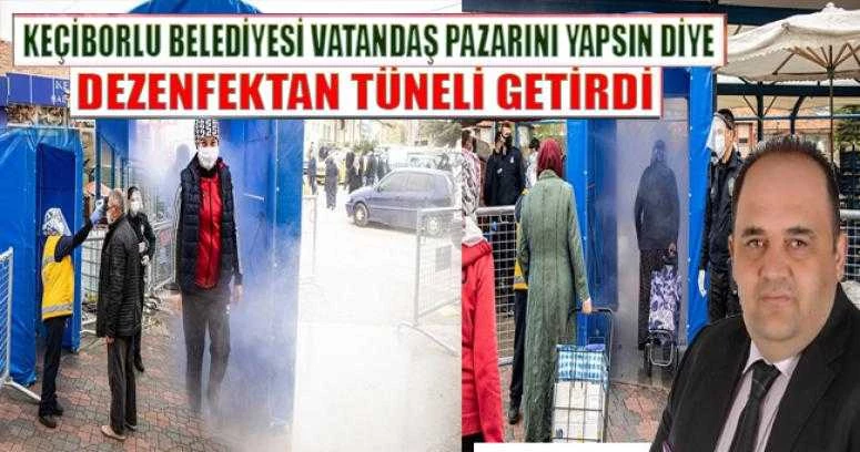 KEÇİBORLU BELEDİYESİ VATANDAŞ PAZARINI YAPSIN DİYE DEZENFEKTAN TÜNELİ GETİRDİ